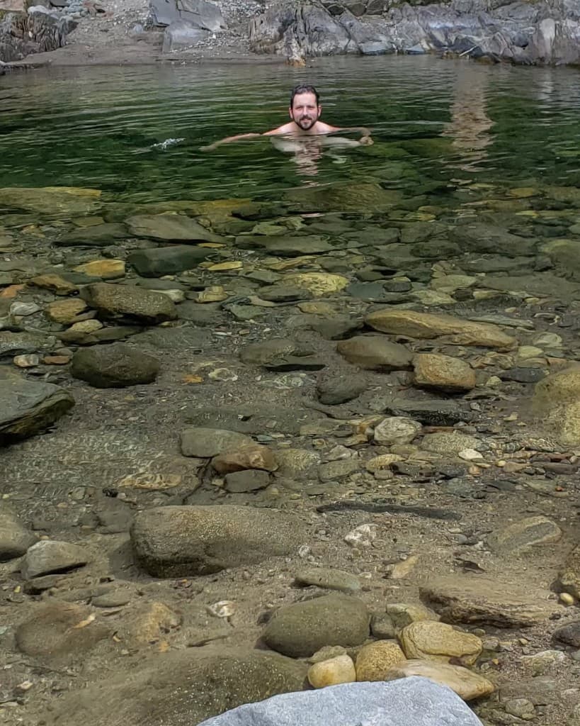 Clear shallow water over river stones — typical cobble bed along Rock River.